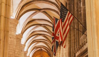 American & United Kingdom flags inside Gloucester cathedral