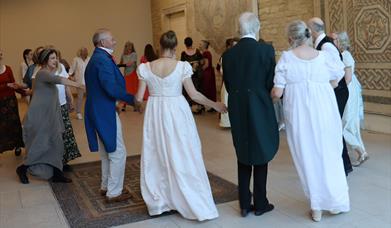 People dancing in Regency costume